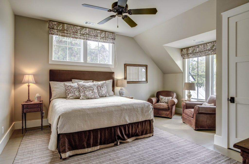 Beautiful luxurious upstairs bedroom with ample windows and leat