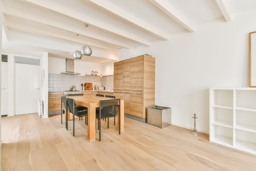 Lovely spacious dining room with a solid wood table