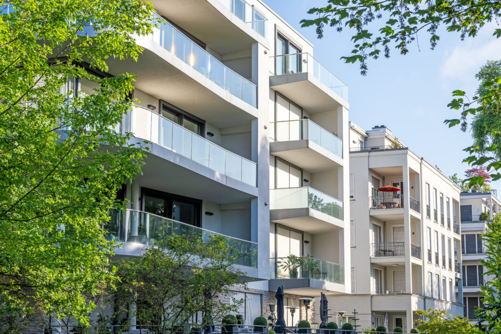 modern-apartment-buildings-surrounded-by-greens-2025-03-09-20-15-14-utc